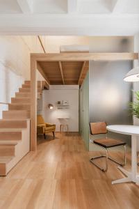 a room with a staircase and a table and chairs at SCALA by Valletta Vintage in Valletta