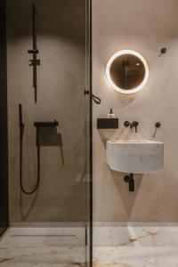 a bathroom with a sink and a shower at SCALA by Valletta Vintage in Valletta