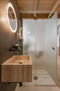 a bathroom with a sink and a glass shower at SCALA by Valletta Vintage in Valletta