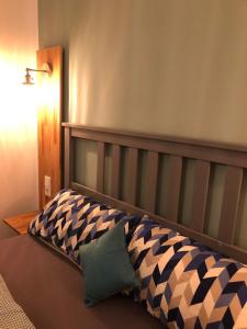 En eller flere senge i et værelse på MSF Apartment Blauer Wolf