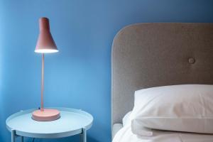 Posteľ alebo postele v izbe v ubytovaní Casapiu Rooms