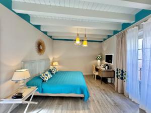 Televízia a/alebo spoločenská miestnosť v ubytovaní Hotel San Michele