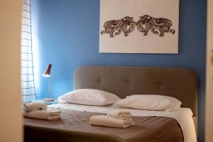 Posteľ alebo postele v izbe v ubytovaní Casapiu Rooms