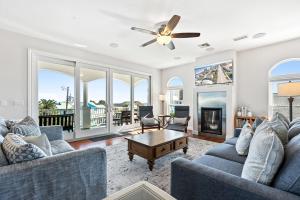 a living room with two couches and a table at Oceanview Family & Pet-Friendly Escape, 300 Steps to Beach, 2608H in New Smyrna Beach