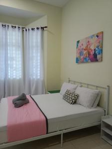 Ένα ή περισσότερα κρεβάτια σε δωμάτιο στο Mutiara Homestay Temerloh