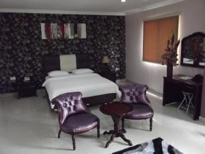 Rúm í herbergi á Hotel Arisu