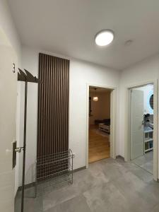 an empty room with a hallway with a door to a room at MA Apartments - Free Parking, Free WiFi, Relax & Coffee, in Duisburg