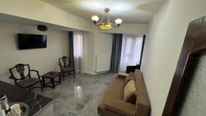 TV a/nebo společenská místnost v ubytování Hotel Majestic