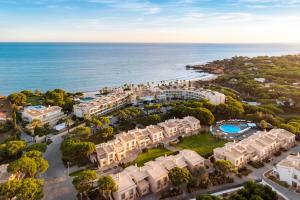an aerial view of a resort near the ocean at Grande Real Santa Eulalia Resort & Hotel Spa in Albufeira