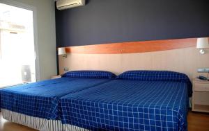 Posteľ alebo postele v izbe v ubytovaní Hotel President