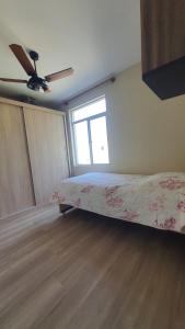 Postel nebo postele na pokoji v ubytování Quarto Pacífico + 4 fotografie