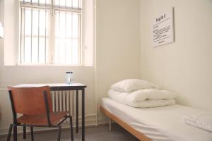 Giường trong phòng chung tại SleepIn FÆNGSLET