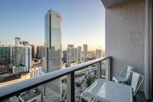 a balcony with a view of a city skyline at High Floor Studio Pool Gym Brickell in Miami