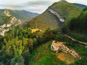 an aerial view of a house in the mountains at Chalet Torcel- Hidden Nature & Spa Retreat Dolomites in San Lorenzo in Banale