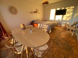 a bedroom with a bed and a table and chairs at 6-people top floor appart, calm, metro in Toulouse