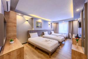 Postel nebo postele na pokoji v ubytování EViM HOTEL ÇORLU