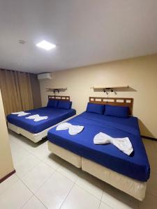 Postel nebo postele na pokoji v ubytování 101 Suites