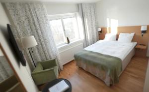 Postel nebo postele na pokoji v ubytování Wiks Slott
