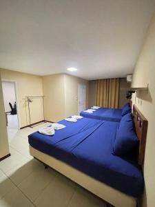 Postel nebo postele na pokoji v ubytování 101 Suites
