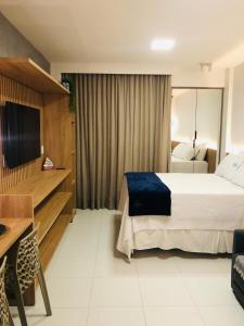 Ένα ή περισσότερα κρεβάτια σε δωμάτιο στο MALIA BEACH EXPERIENCE - FLAT ESTÚDIO LOCAÇÃO - Muro Alto - Porto de Galinhas