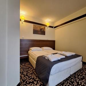 Posteľ alebo postele v izbe v ubytovaní Hotel i Aquapark Olender