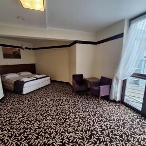 Posteľ alebo postele v izbe v ubytovaní Hotel i Aquapark Olender