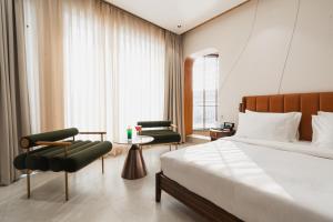 AVA Hotel Chandigarh Zirakpur客房内的一张或多张床位