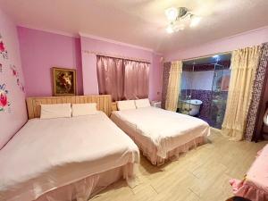 Postel nebo postele na pokoji v ubytování Love in Pearl B&B