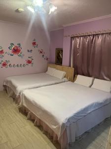 Postel nebo postele na pokoji v ubytování Love in Pearl B&B