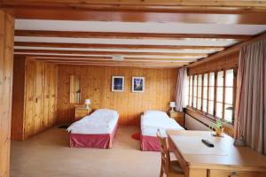 Postel nebo postele na pokoji v ubytování Hotel am Schönenbühl
