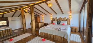 a bedroom with a large bed in a room at Вили Панорама Лещен in Leshten