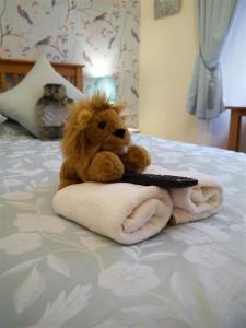 Ένα ή περισσότερα κρεβάτια σε δωμάτιο στο Ardwell House East Lodge