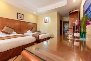 Postel nebo postele na pokoji v ubytování Mbale Resort Hotel