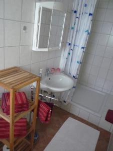 a bathroom with a sink and a shower at Ferienwohnung Monteurwohnung in Pforzheim