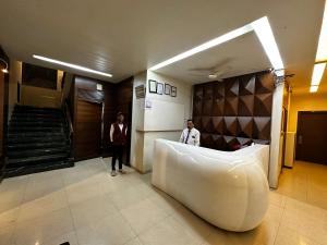 Postel nebo postele na pokoji v ubytování The Saffron Suites + 37 fotografií