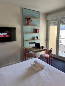 Postel nebo postele na pokoji v ubytování Appart'Hôtel Lauréades Clermont-Ferrand Centre Jaude