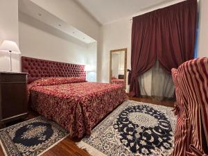 a hotel room with two beds and a mirror at B&B Da Gina in Senigallia