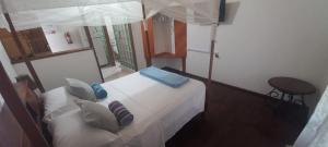 Кровать или кровати в номере Castara Bliss Vacation Apartments Tobago