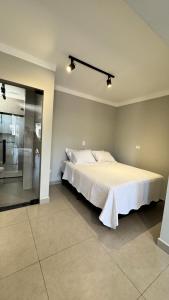 a bedroom with a large bed in a room at Pousada Vale das Águas in Águas de São Pedro
