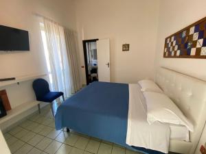 Postel nebo postele na pokoji v ubytování Hotel Vietri Coast