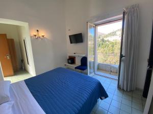 Postel nebo postele na pokoji v ubytování Hotel Vietri Coast