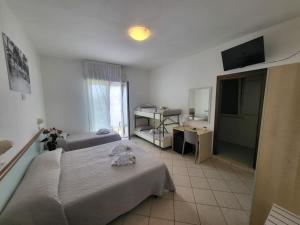 Posteľ alebo postele v izbe v ubytovaní Hotel Amedea