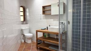a bathroom with a sink and a toilet at Casita Pin i Pon Town House, Javea in Jávea +4 photos
