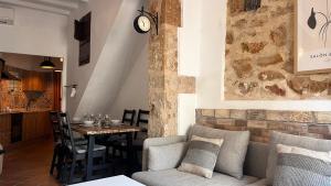 a living room with a table and a couch at Casita Pin i Pon Town House, Javea in Jávea