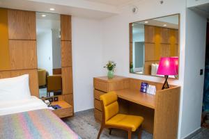 Voodi või voodid majutusasutuse Eko Hotel Main Building toas