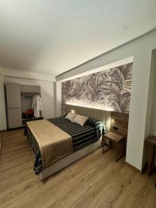 Posteľ alebo postele v izbe v ubytovaní Hotel Corallo