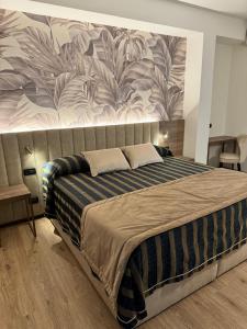 Posteľ alebo postele v izbe v ubytovaní Hotel Corallo