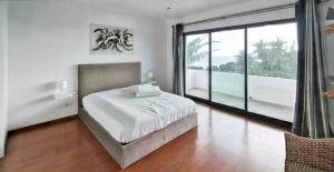 a bedroom with a bed and a large window at Exceptional villa in Vila Franca Do Campo with private pool in Vila Franca do Campo