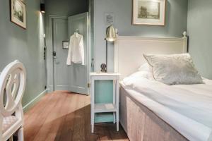 Llit o llits en una habitació de Hotel Kungsträdgården