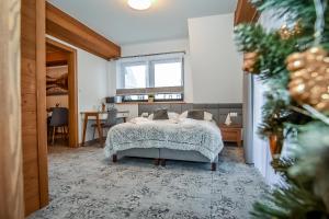 Posteľ alebo postele v izbe v ubytovaní Apartamenty Pod Tatrzańskim Niebem